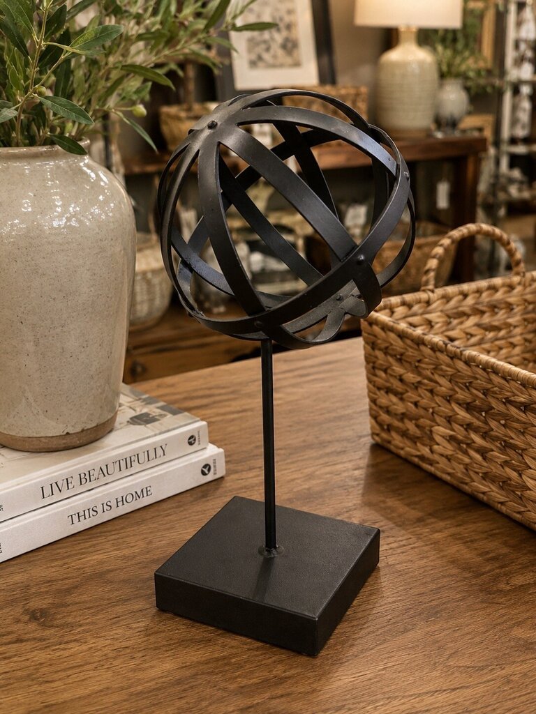 Black Metal Sphere on Display Stand